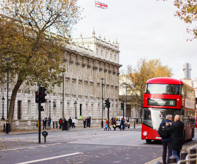 A view of a street in Fulham featuring a red double decker bus.